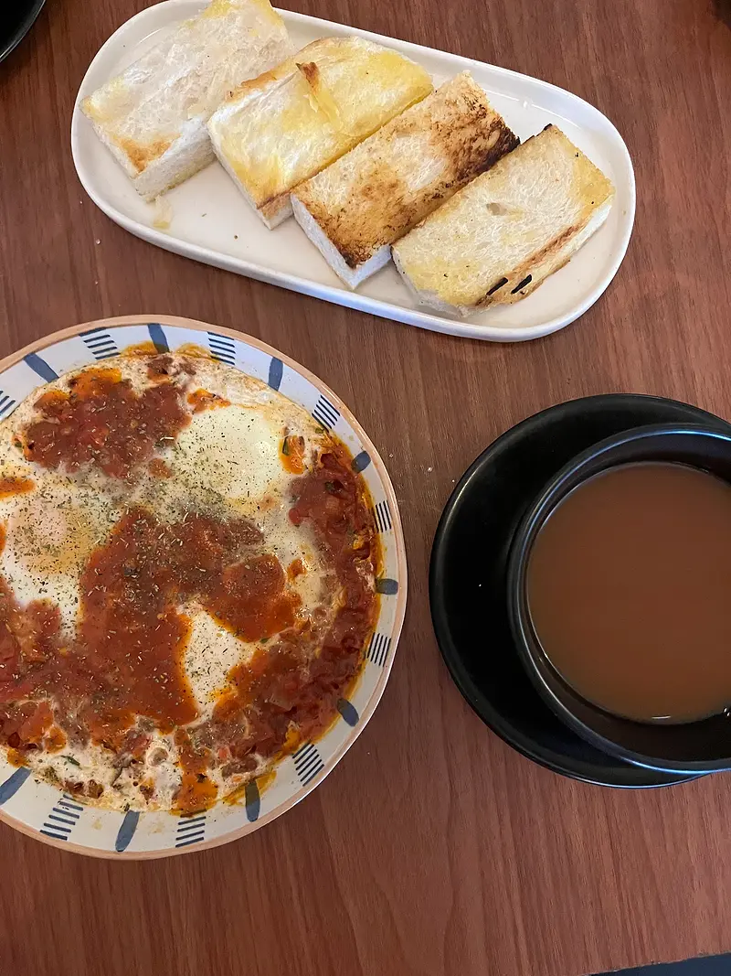 Shakshuka with toasted bread and a cup of Ceylon tea